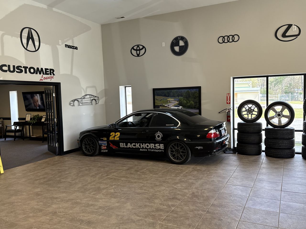 Showroom with the Blackhorse race car and display wheels
